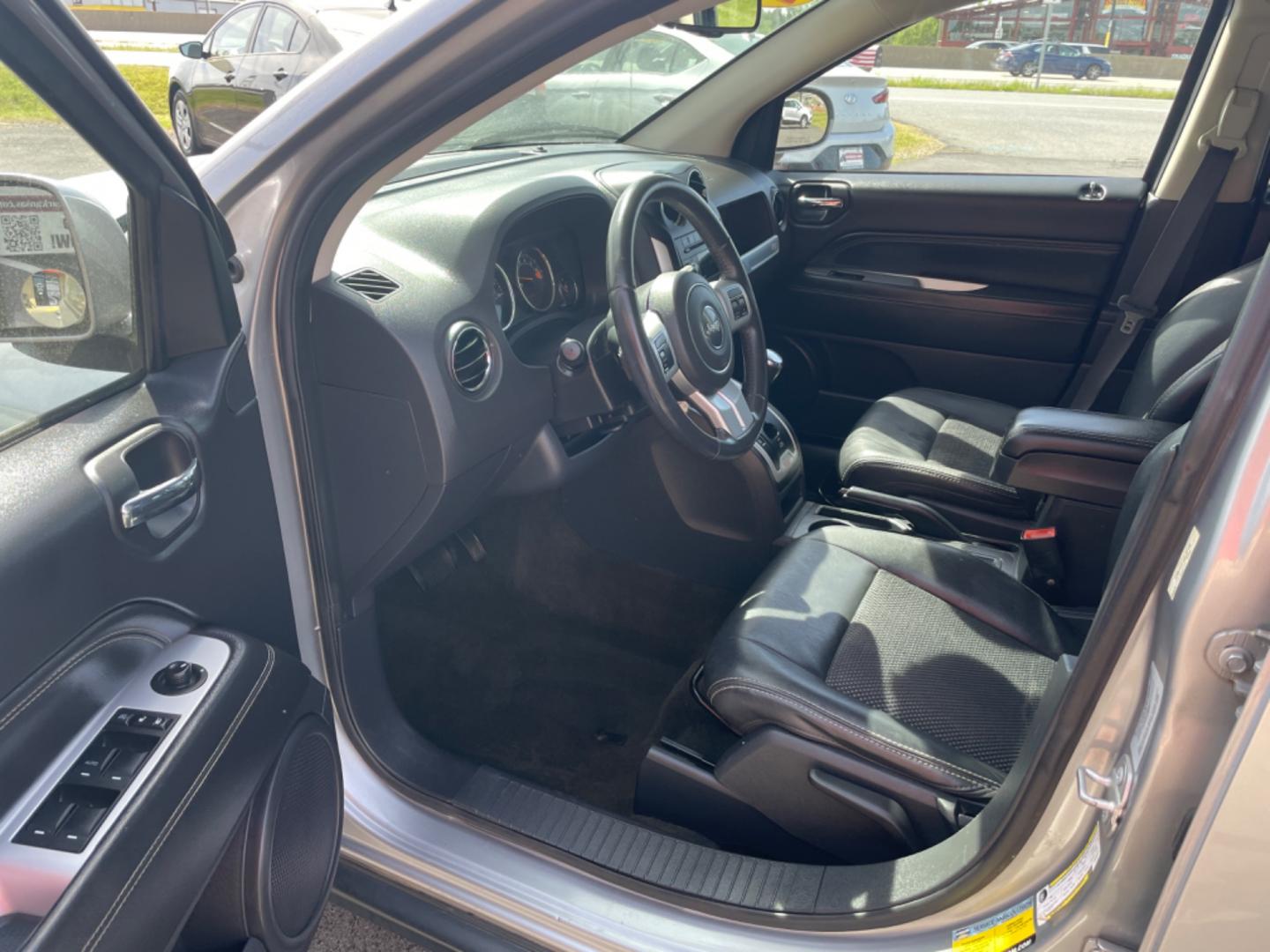 2016 Silver Jeep Compass (1C4NJCEA4GD) with an 4-Cyl, 2.0 Liter engine, Automatic, CVT transmission, located at 8008 Warden Rd, Sherwood, AR, 72120, (501) 801-6100, 34.830078, -92.186684 - Photo#12